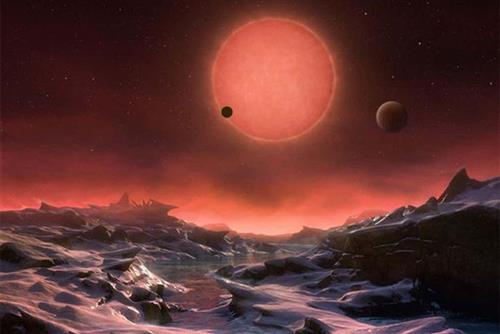 Mô tả của nghệ sĩ về quang cảnh trên 1 trong 3 hành tinh được cho là có sự sống của hệ 7 hành tinh giống Trái Đất - Ảnh: New Scientist